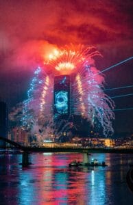 Stunning fireworks over Belgrade skyscraper illuminating the night sky. Perfect for festive and travel themes.